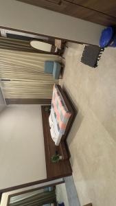 an overhead view of a living room with a couch and a table at Siddhi farm in Kolhapur
