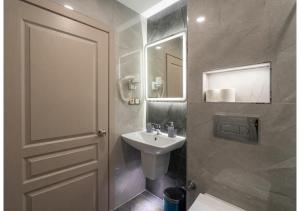 a bathroom with a white sink and a mirror at Hotel Tulip House in Istanbul +125 photos