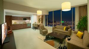 a large living room with a view of a city at Ascott Rafal Olaya Riyadh in Riyadh