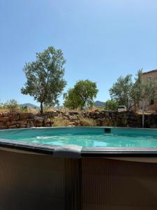a hot tub in the backyard of a house at Mas de Manresa in Horta de San Joan
