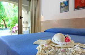Postel nebo postele na pokoji v ubytování Sitia Beach City Resort & Spa