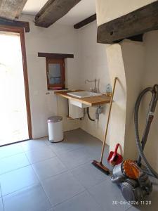 a kitchen with a sink and a counter in a room at Gîte Chevannes - Holiday home - Pool - Parking - Mobility friendly - Pets welcome in Fours +46 photos