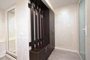 a room with a closet with a glass door at Old Yerevan Guesthouses in Yerevan