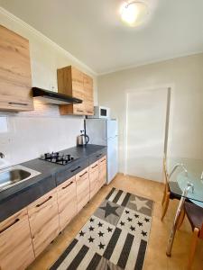 a kitchen with a sink and a stove top oven at Котедж в горах у Антоніни in Solochyn +44 photos