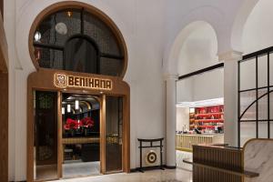 an entrance to a restaurant with a sign on the door at Oaks Ibn Battuta Gate Dubai in Dubai +70 photos