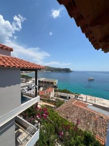 a view of the ocean from the balcony of a house at Margarita Guesthouse in Himare