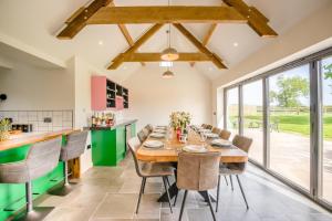 a kitchen and dining room with a table and chairs at 7 Bed in Welshpool oc-96412 in Berriew