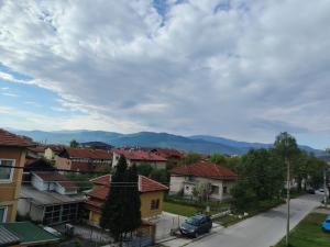 a view of a town with houses and mountains at Апартамент Четири сезона 2 in Velingrad