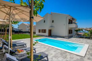 an image of a villa with a swimming pool at Villa Botanica near Split - Heated Pool and Garden in Kučine