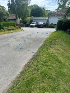 a street with blue bumps in the middle of the road at Cozy apartment in Tananger close to the Airport in Tananger