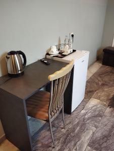 a chair sitting at a desk in a kitchen at The Corner Hotel in Yerevan