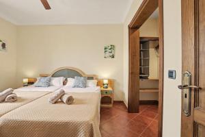 a hotel room with two beds and a hallway at Rincón de Daute in Los Silos