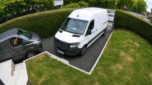 a white van is parked in a parking lot at Contractor Base Newport 3 Bed Van Parking Sleeps 5 in Newport