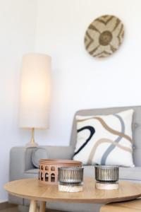 a coffee table in a living room with a couch at Dimitra Beach Apartments - Thassos Skala Potamias in Skala Potamias