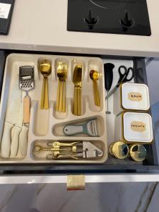 a drawer filled with various utensils in a drawer at Villa Lulu in Warsaw