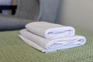 a pile of towels sitting on top of a table at MŁYŃSKA 8 Opole-Górki in Opole +79 photos