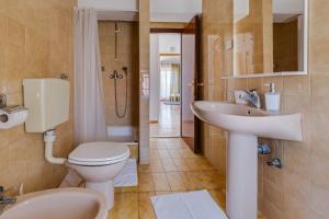 a bathroom with a toilet and a sink and a shower at Apartmani Katica in Diklo +35 photos