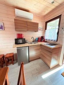 a kitchen with a sink and a counter top at Wakacje Bobolin in Bobolin