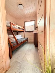 a room with two bunk beds in a cabin at Wakacje Bobolin in Bobolin +36 photos