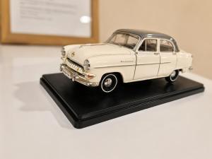 a model of a white car on a black table at Apartment Underground, Premium Apartment in Ruse City Centre in Ruse