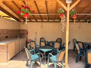 a room with a table and chairs and a kitchen at Амон Ра 2 in Primorsko