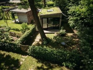 an overhead view of a house with a tree at Boshuisje Zelhem in Zelhem +12 photos