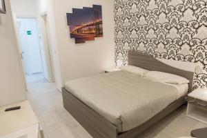 Posteľ alebo postele v izbe v ubytovaní Metronia Guest House