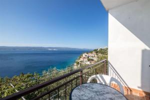 a balcony with a view of the ocean at See view Apartment 2 in Mimice