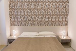 Posteľ alebo postele v izbe v ubytovaní Metronia Guest House