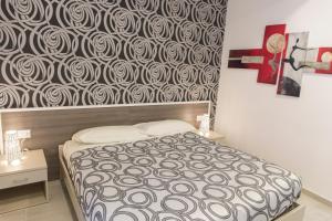 Posteľ alebo postele v izbe v ubytovaní Metronia Guest House