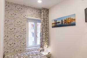 Posteľ alebo postele v izbe v ubytovaní Metronia Guest House