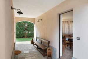 a hallway with a bench in a house at Au Petit Chevrot - Garden in Aosta