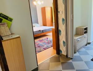 a room with a door leading to a bedroom at Téesz Vendégház in Zalaháshágy