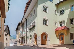 a building on the side of a street at Appartamenti Boé 1 in Livinallongo del Col di Lana