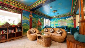 a childrens room with a dinosaur mural on the wall at Hotel Sherwi Hyul in Kathmandu