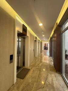 an empty hallway of a building with a hallwayngth at PMTR Residence in Bar