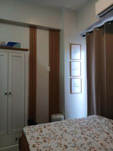 a hotel room with a bed and a window at Sanctuary 5125 by Primeworld District in Agus +12 photos