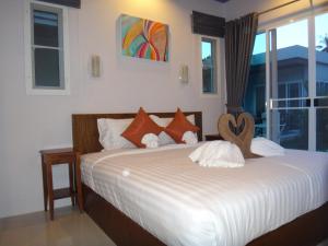 Postel nebo postele na pokoji v ubytování Thuan Resort