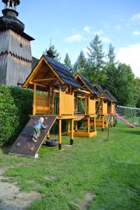 a child on a slide in a playground at Willa Wiktoria 2 in Zakopane