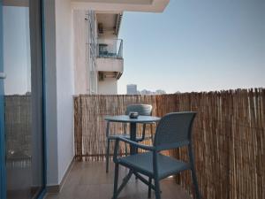a table and chair on a balcony with a view at Studio Privat Reea Olimp in Olimp