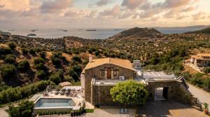 an aerial view of a house with a swimming pool at Saronic Citadel Luxury Villa-Private Estate on Salamina Island in Salamina