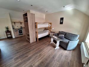 a living room with a couch and a bunk bed at Ridge-Rock Accommodation in Carrick on Shannon