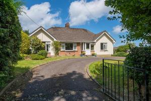 a house with a gate in front of a driveway at Glandraeth in Newport