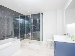 a bathroom with a shower and a toilet and a sink at Primrose-Uk34614 in Nether Stowey