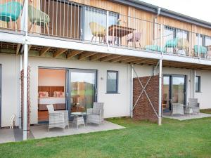 a house with a balcony with chairs and a bed at Primrose-Uk34614 in Nether Stowey +33 photos