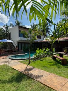 a villa with a swimming pool and a resort at Casa Gili Moitas in Praia de Moitas +27 photos