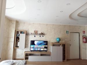 a living room with a flat screen tv on a wall at Pimpus in Cicciano