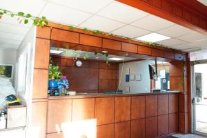 a kitchen with a large mirror on the wall at La Casa Inn Albany Near Tifton GA I 75 in Albany