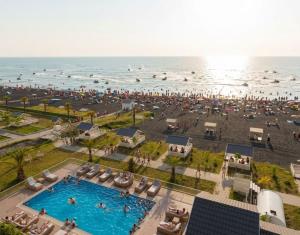 an overhead view of a beach with a swimming pool and the ocean at Astalanya City in Astara
