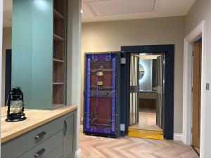 a room with a mirror and a dresser and a room at The Old Bank in Warrenpoint